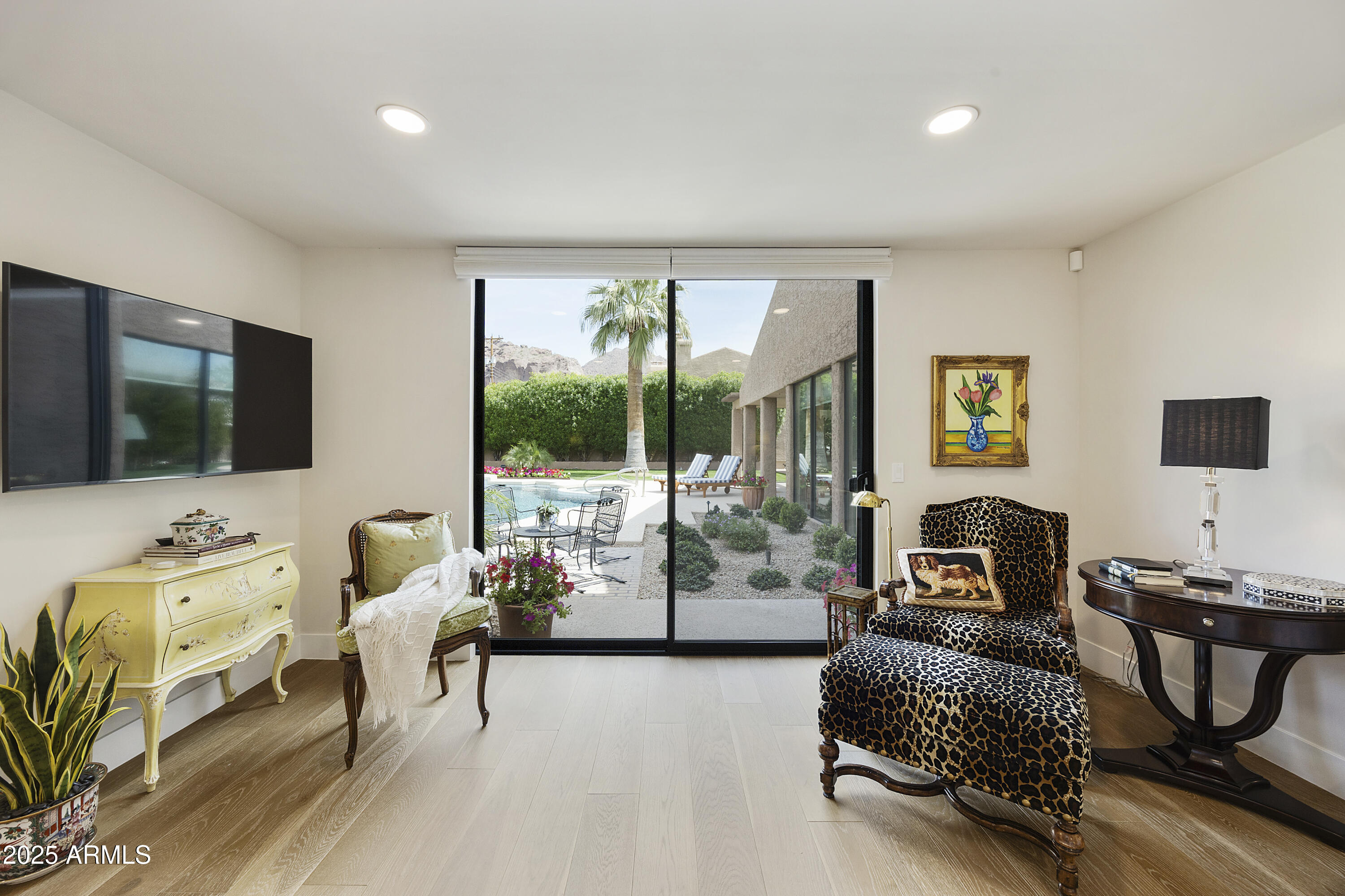 4436 East Camelback Road, Unit 37 Phoenix, AZ 85018 - Photo 9 of 55 a living room with furniture and a flat screen tv