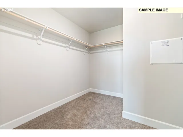a bathroom with a double vanity sink mirror and toilet