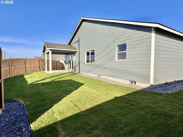 a backyard of a house with lots of green space