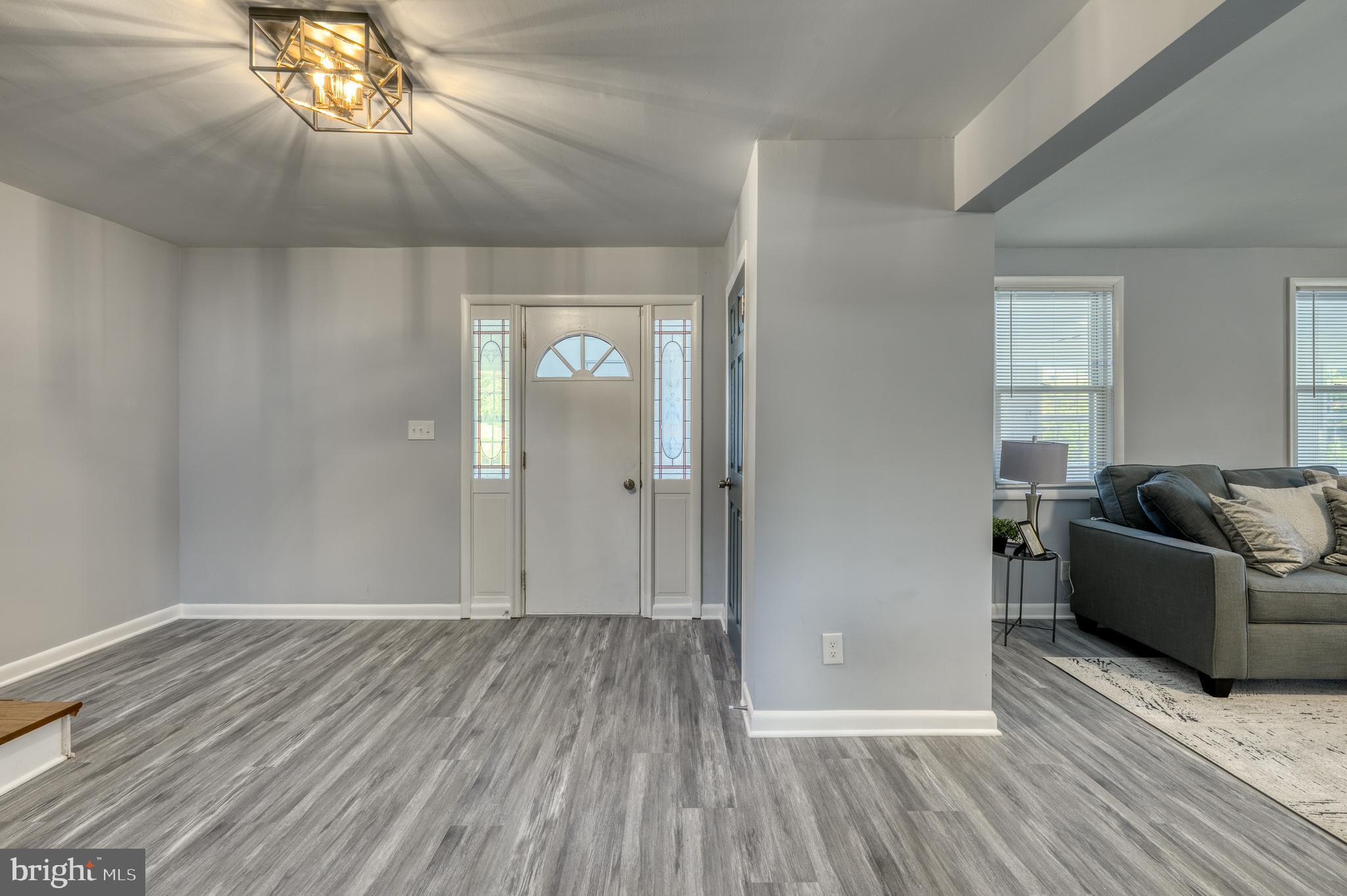 510 Middle River Road Baltimore, MD 21220 - Photo 8 of 65 a view of livingroom with furniture and wooden floor