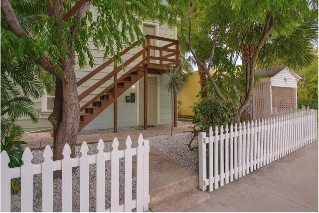 a view of a house with a small yard