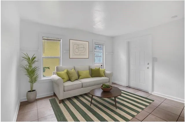 a living room with furniture and a rug