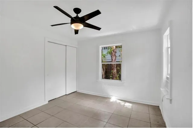 a view of an empty room with a window