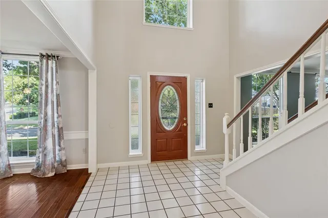 a view of an entryway with wooden floor and door