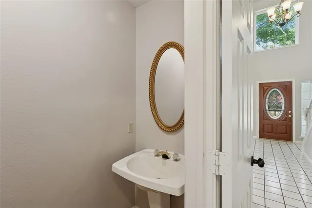 a bathroom with a sink a mirror and a shower