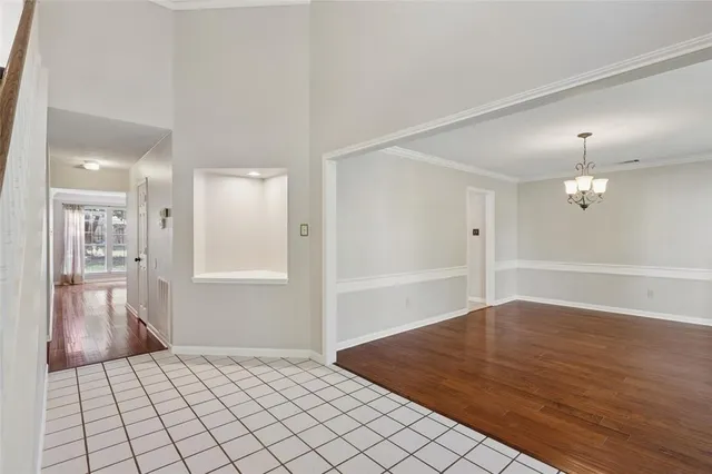 an empty room with wooden floor