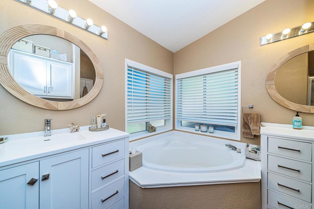 4747 Oak Crest Road, Unit 8 Fallbrook, CA 92028 - Photo 14 of 36 a bathroom with a sink and a mirror