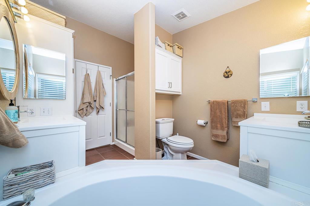 4747 Oak Crest Road, Unit 8 Fallbrook, CA 92028 - Photo 15 of 36 a bathroom with a toilet a sink and a shower