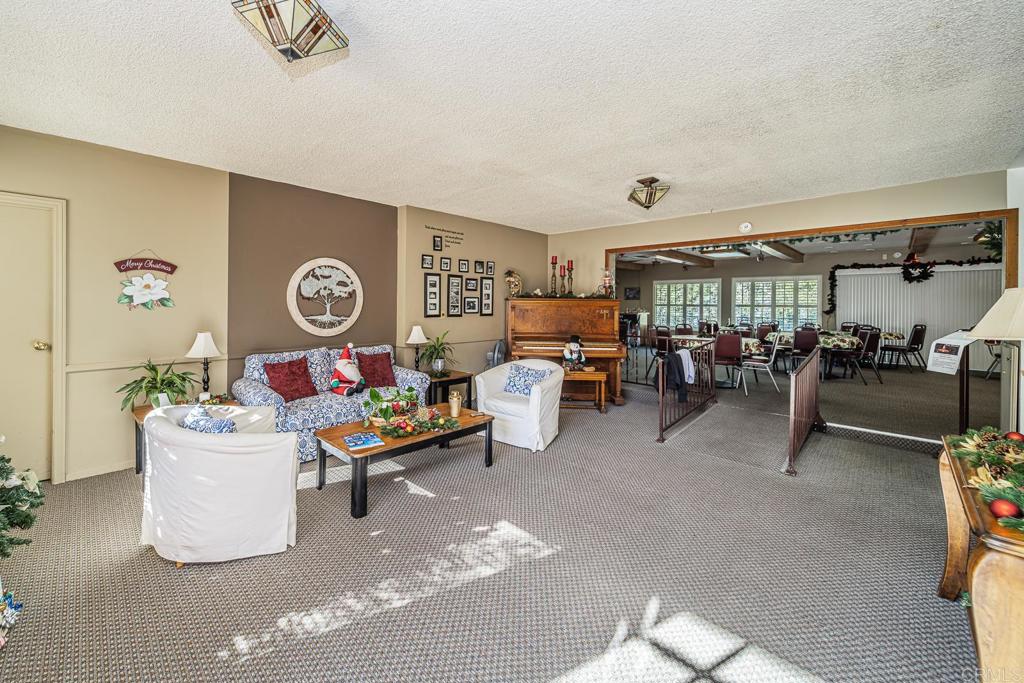 4747 Oak Crest Road, Unit 8 Fallbrook, CA 92028 - Photo 32 of 36 a living room with furniture and a window