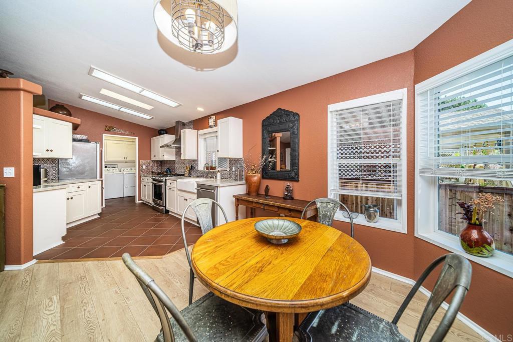 4747 Oak Crest Road, Unit 8 Fallbrook, CA 92028 - Photo 8 of 36 a view of a dining room with furniture window and wooden floor