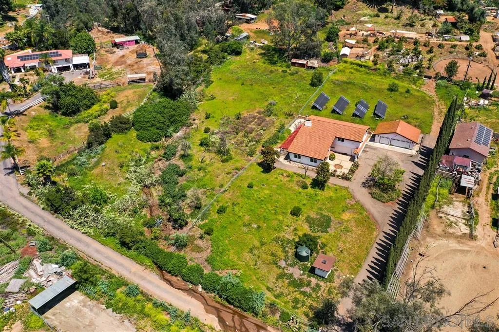 15157 Crocker Road Poway, CA 92064 - Photo 1 of 22 an aerial view of a house with a yard and lake view