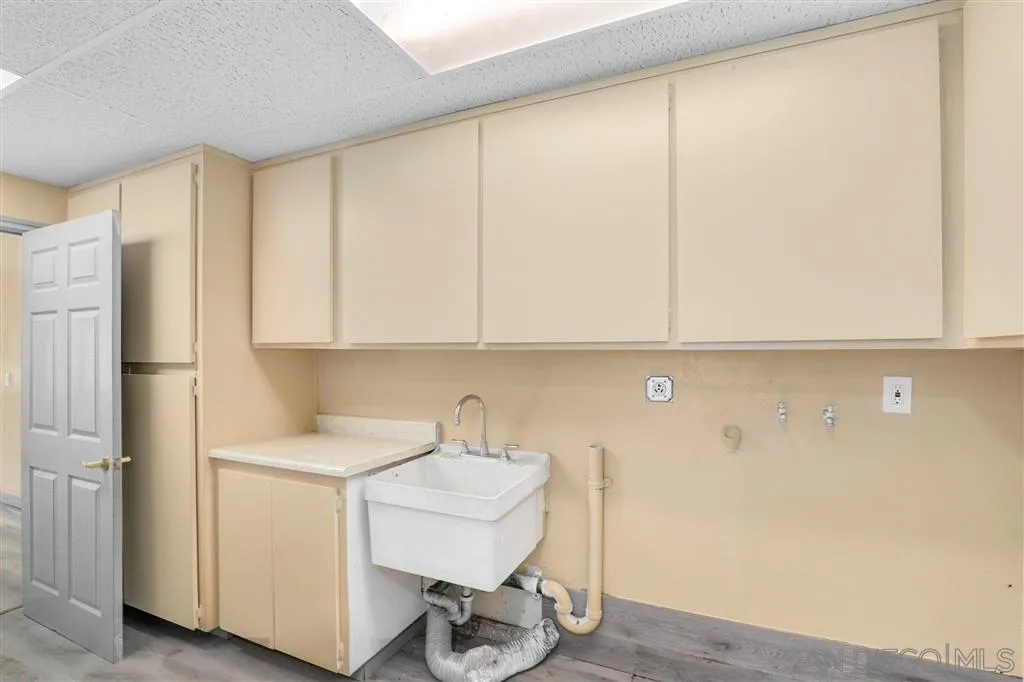 15157 Crocker Road Poway, CA 92064 - Photo 12 of 22 a room with a sink and cabinets