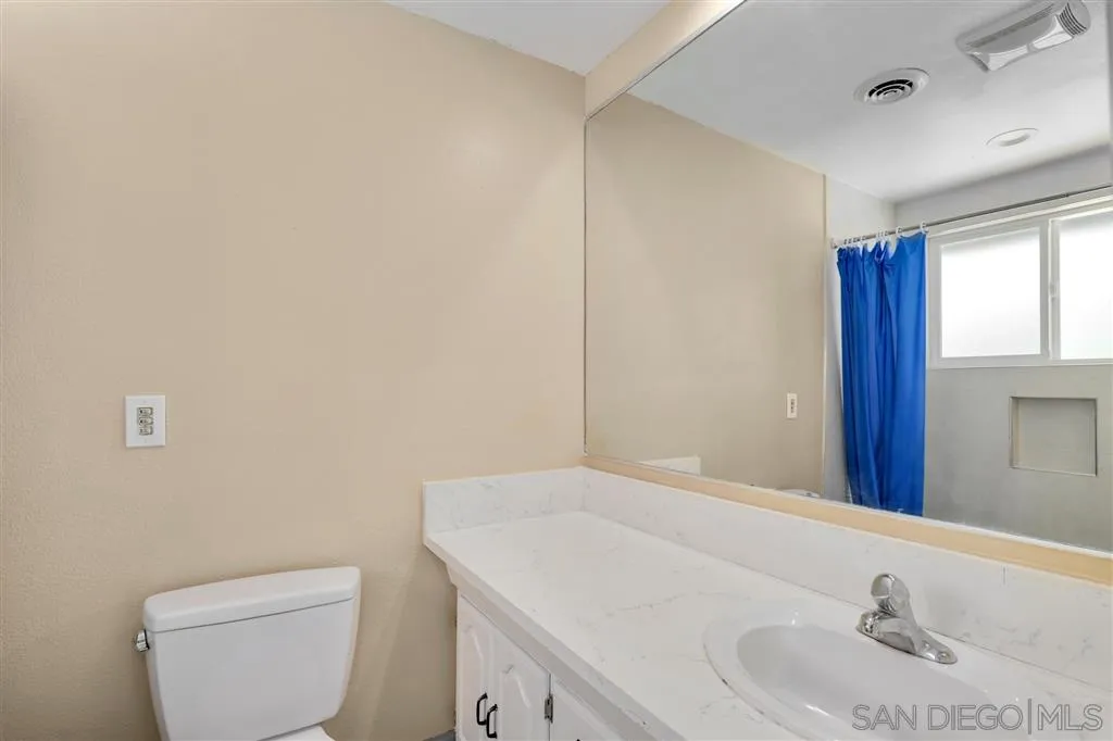 15157 Crocker Road Poway, CA 92064 - Photo 14 of 22 a bathroom with a sink a toilet and vanity