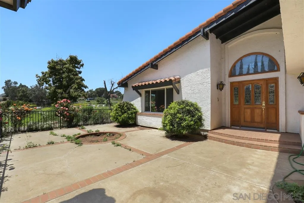 15157 Crocker Road Poway, CA 92064 - Photo 17 of 22 a front view of a house with a garden
