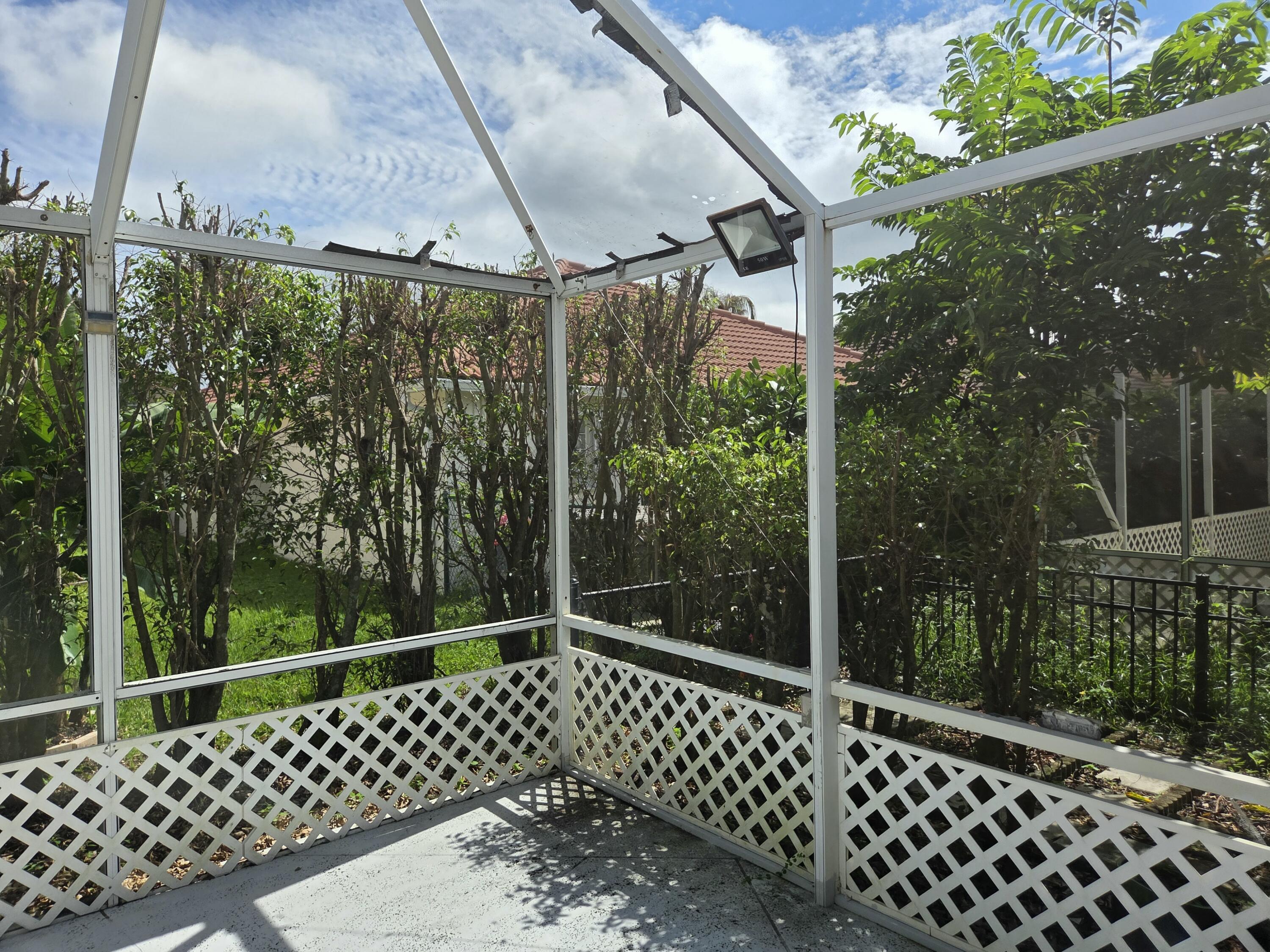 3021 Casa Rio Court Riviera Beach, FL 33418 - Photo 15 of 16 a black and white bench sitting in front of a building