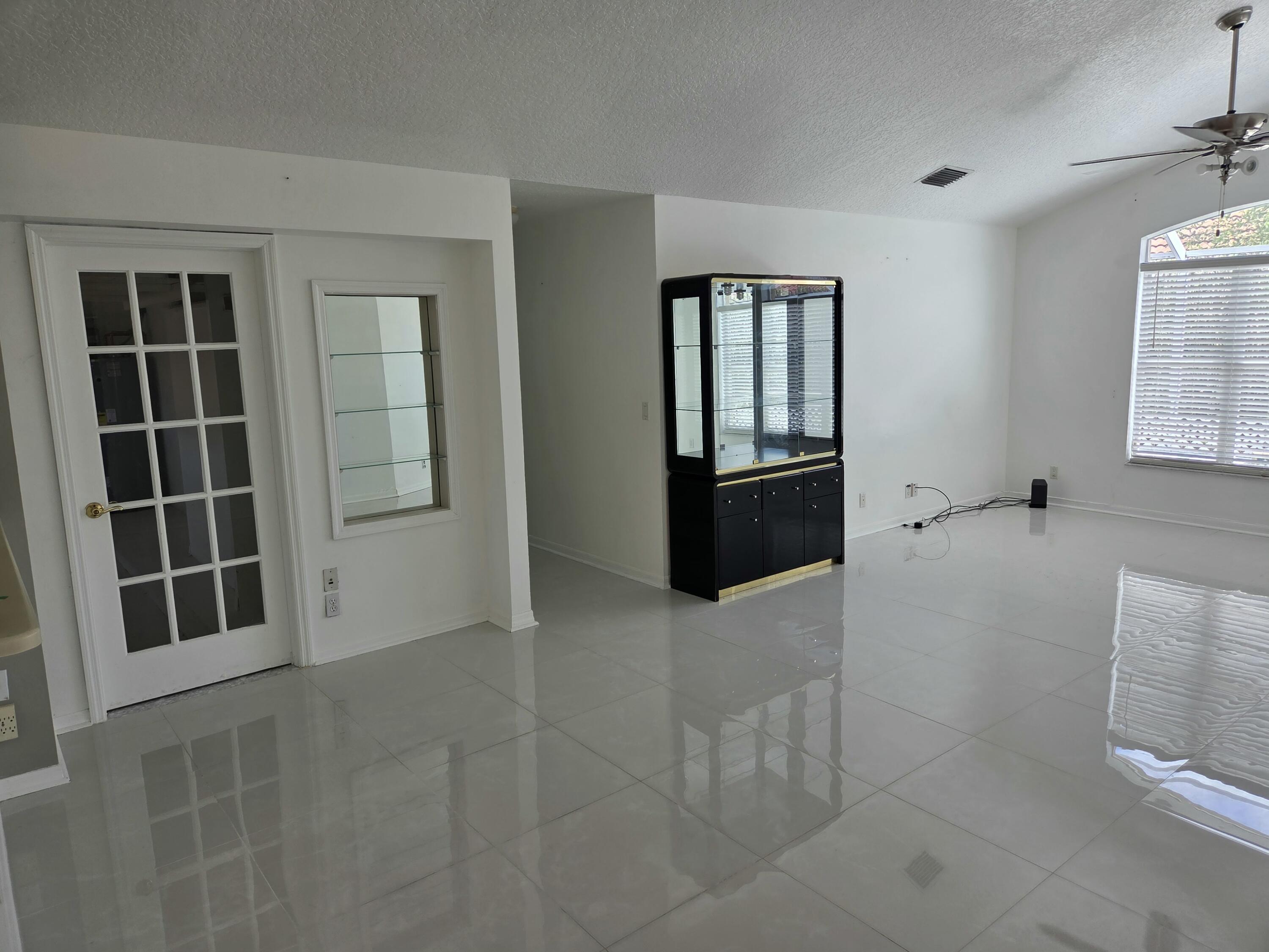 3021 Casa Rio Court Riviera Beach, FL 33418 - Photo 8 of 16 an empty room with windows