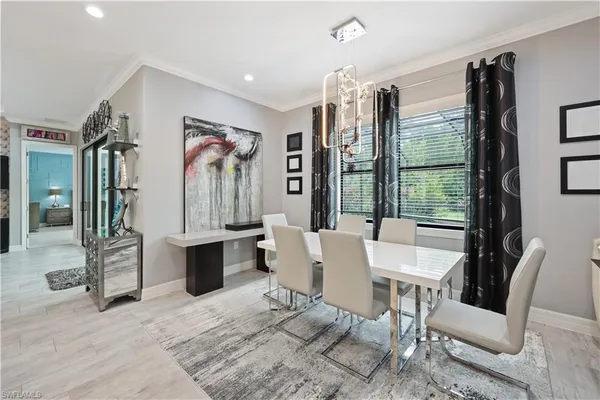 a view of a dining room with furniture window and outside view