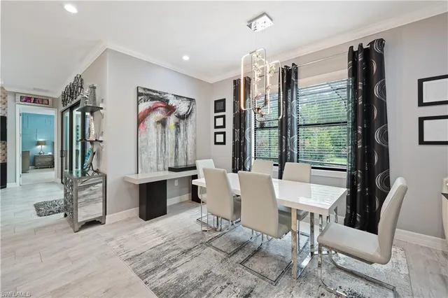 a view of a dining room with furniture window and outside view