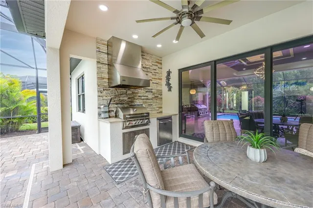 a kitchen with a table and chairs