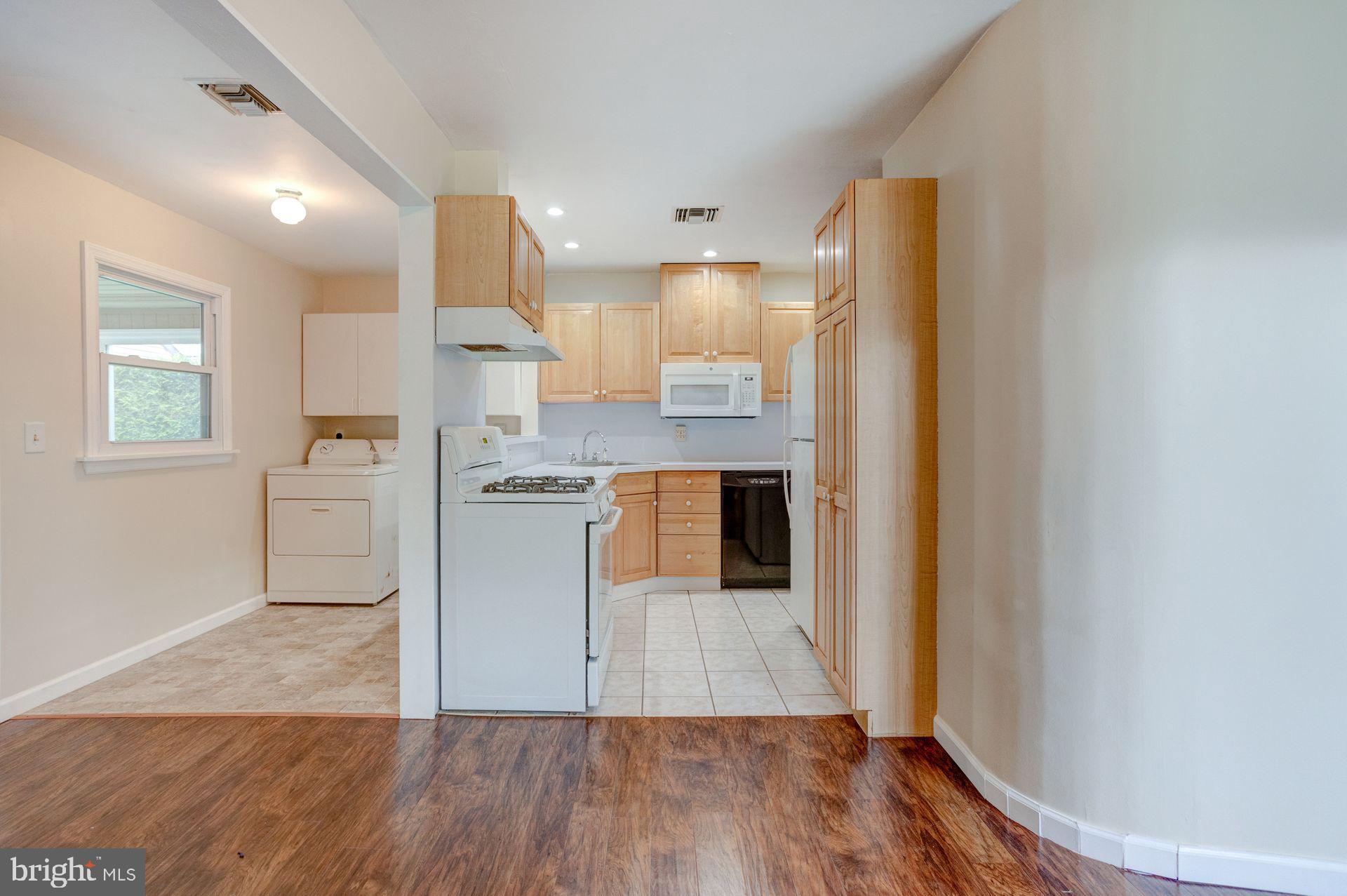 509 Filbert Road Oreland, PA 19075 - Photo 21 of 24 Kitchen and Laundry from Dining Room