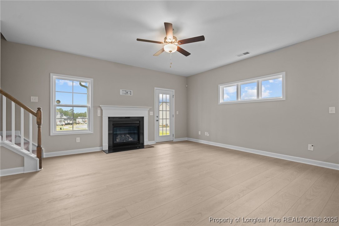 274 Rough Ridge Trail Aberdeen, NC 28315 - Photo 18 of 47 a view of an empty room with window and fireplace