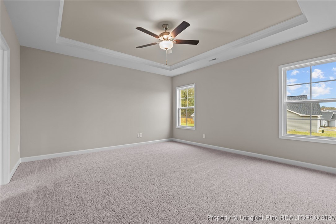 274 Rough Ridge Trail Aberdeen, NC 28315 - Photo 21 of 47 an empty room with windows and ceiling fan