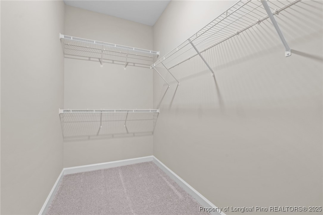 274 Rough Ridge Trail Aberdeen, NC 28315 - Photo 25 of 47 a view of a room with racks on the wall