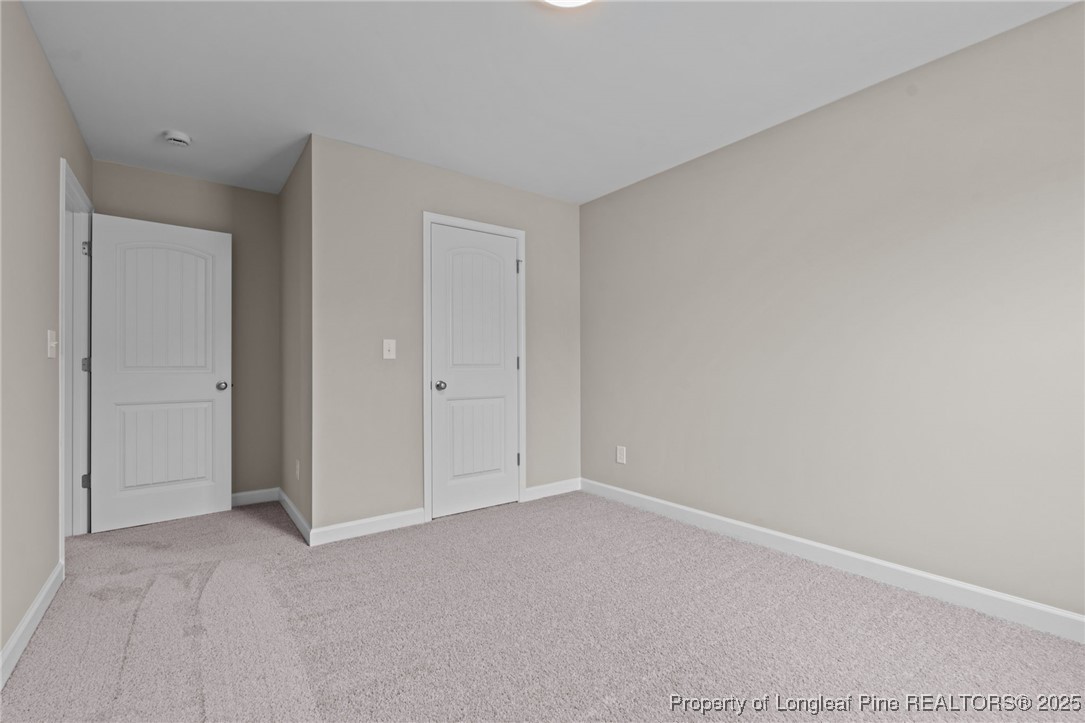 274 Rough Ridge Trail Aberdeen, NC 28315 - Photo 32 of 47 a view of an empty room