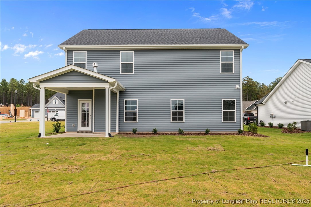 274 Rough Ridge Trail Aberdeen, NC 28315 - Photo 42 of 47 a front view of a house with a yard