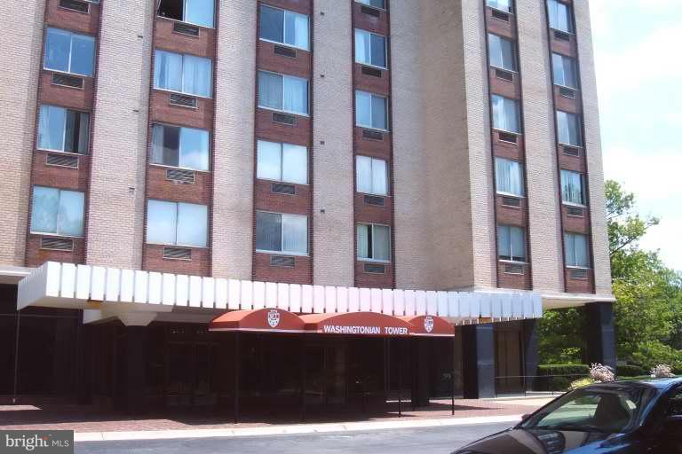 9701 Fields Road, Unit 1106 Gaithersburg, MD 20878 - Photo 1 of 6 a view of a building with a street