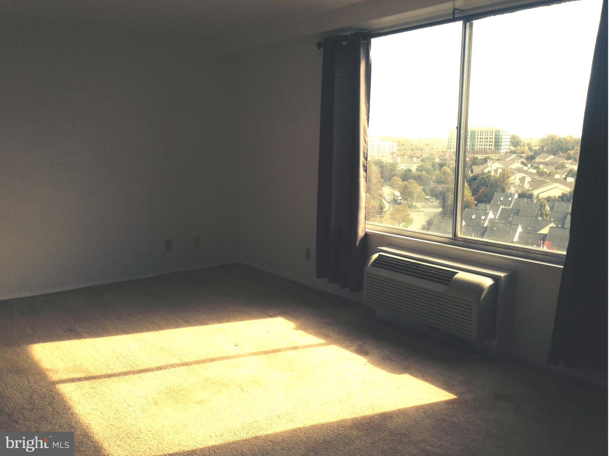 9701 Fields Road, Unit 1106 Gaithersburg, MD 20878 - Photo 5 of 6 a view of an empty room with a window