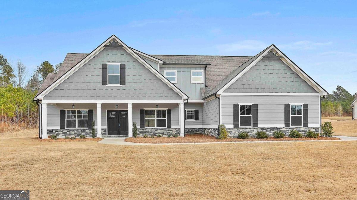 42 Highgate Drive, Unit 1 Newnan, GA 30263 - Photo 1 of 1 a front view of a house with a yard