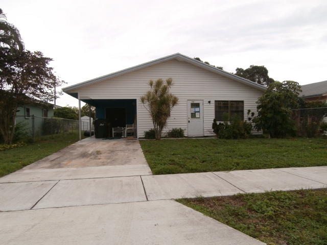 209 Southwest 3rd Avenue Delray Beach, FL 33444 - Photo 1 of 3 a view of a house with a yard and tree s