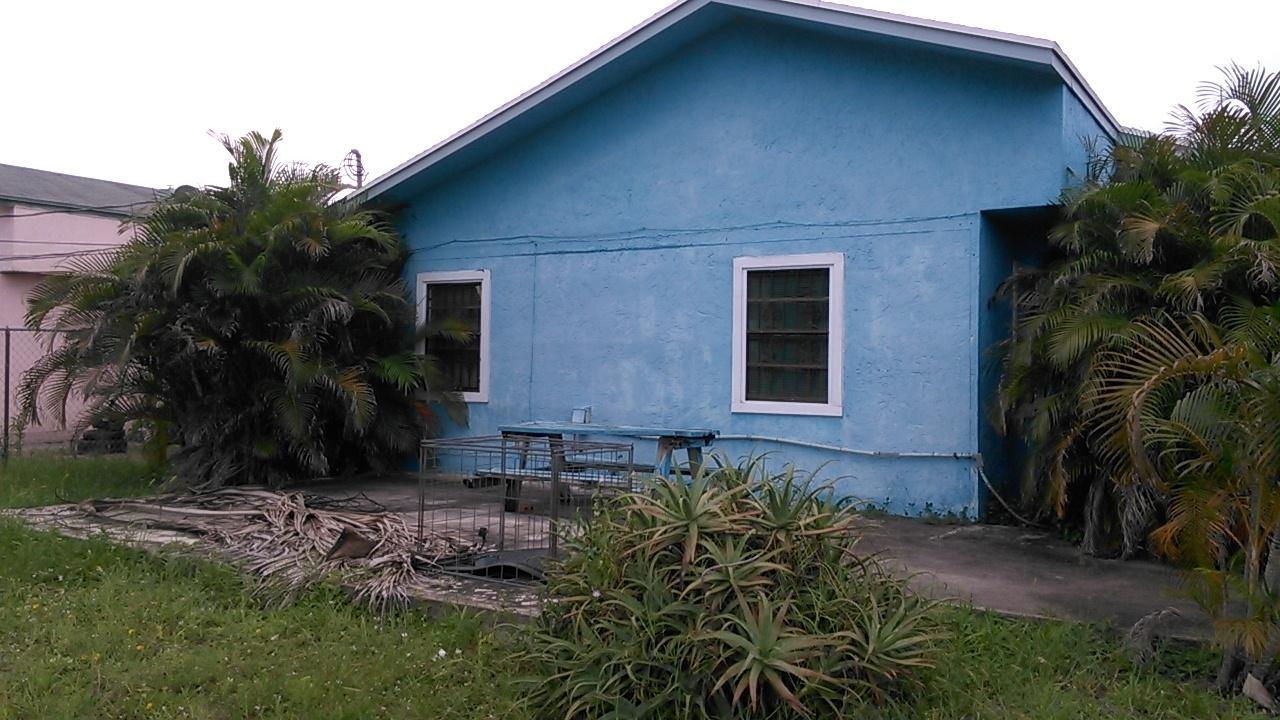 209 Southwest 3rd Avenue Delray Beach, FL 33444 - Photo 2 of 3 a front view of a house with a yard