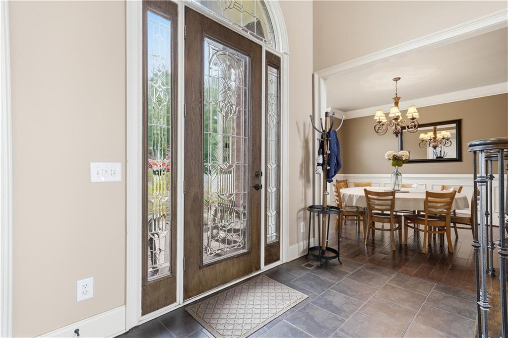 97 Eagle Ridge Trail Cleveland, GA 30528 - Photo 14 of 58 a dining room with furniture and a floor to ceiling window