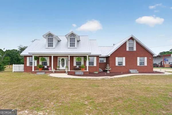 a front view of a house with a yard