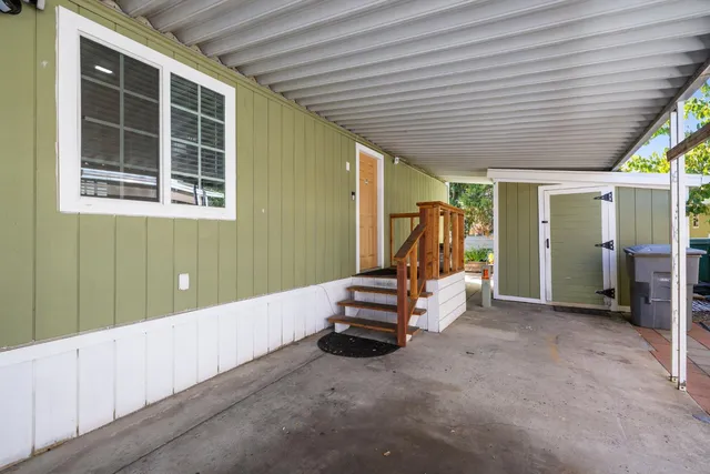a view of a balcony with wooden floor