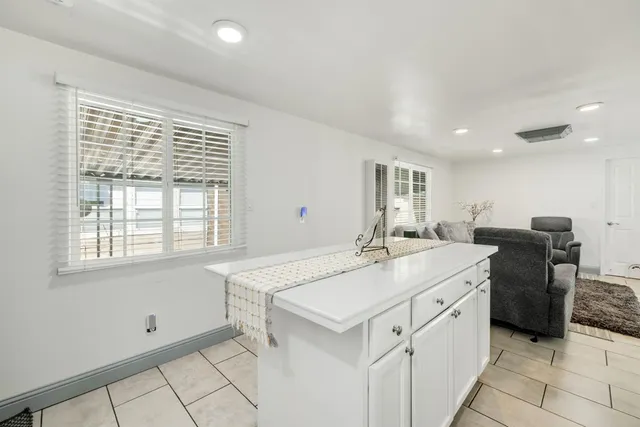 a utility room with sink dryer and washer