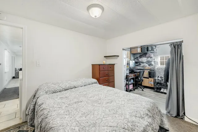 a view of a hall with gym equipment