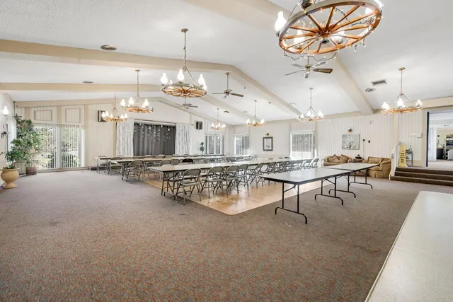 a living room with furniture window and a fireplace