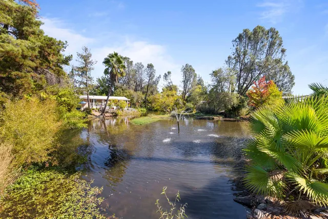 a bathroom with a sink vanity granite and a mirror