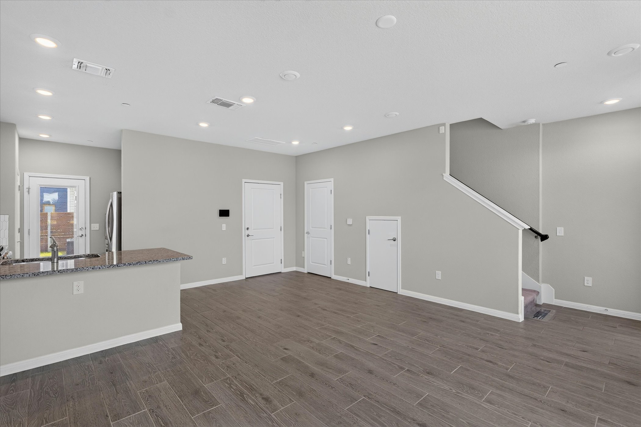 9015 Cattle Baron Path, Unit 1102 Austin, TX 78747 - Photo 25 of 25 An open floorplan with durable flooring connects the kitchen and living areas.
