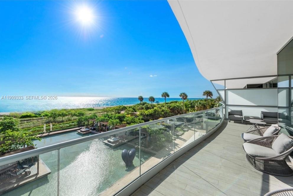9349 Collins Avenue, Unit 304 Surfside, FL 33154 - Photo 1 of 40 a view of a balcony with chairs