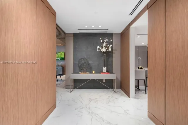 a view of a hallway with a chandelier