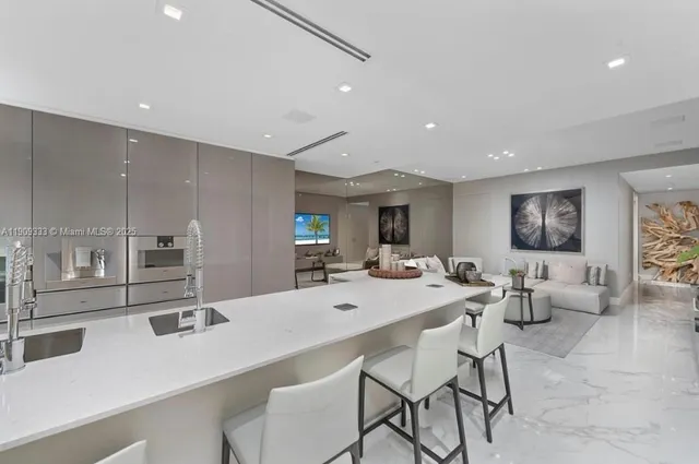a large kitchen with a table and chairs