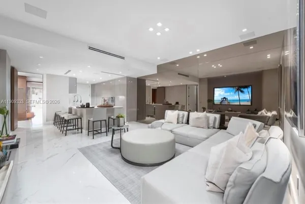 a living room with furniture and lamp