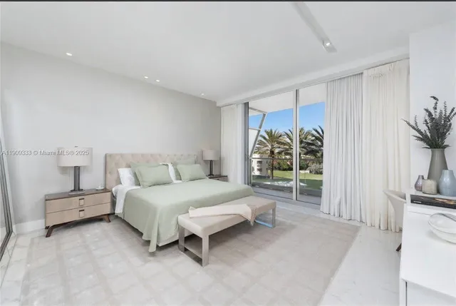 a spacious bedroom with a bed and a couch