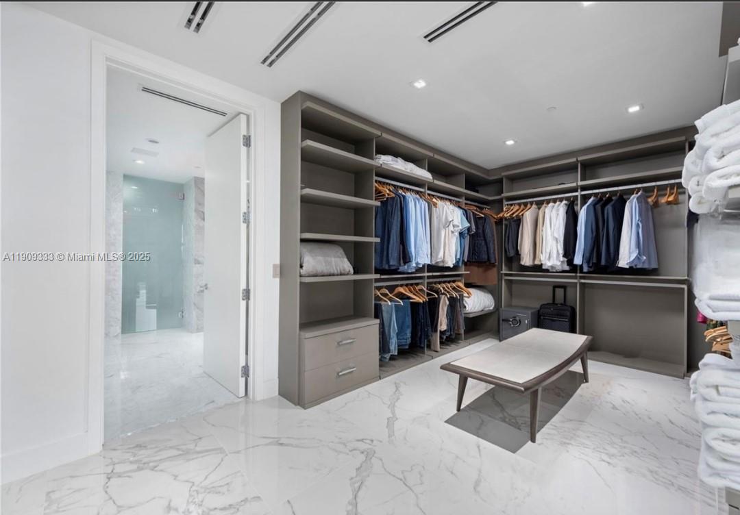 9349 Collins Avenue, Unit 304 Surfside, FL 33154 - Photo 27 of 40 a view of a hallway with seating area and mirrors