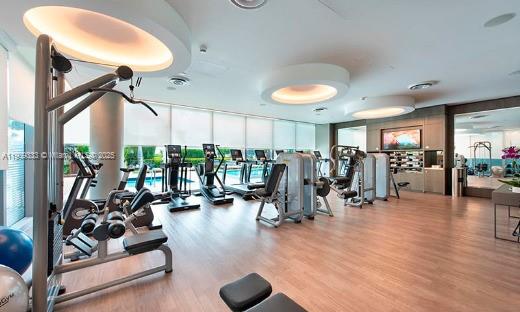 9349 Collins Avenue, Unit 304 Surfside, FL 33154 - Photo 40 of 40 a view of a room with gym equipment