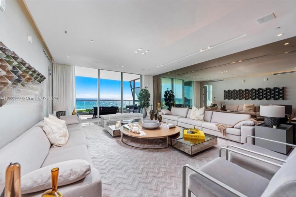 9349 Collins Avenue, Unit 304 Surfside, FL 33154 - Photo 4 of 40 a living room with furniture and a potted plant